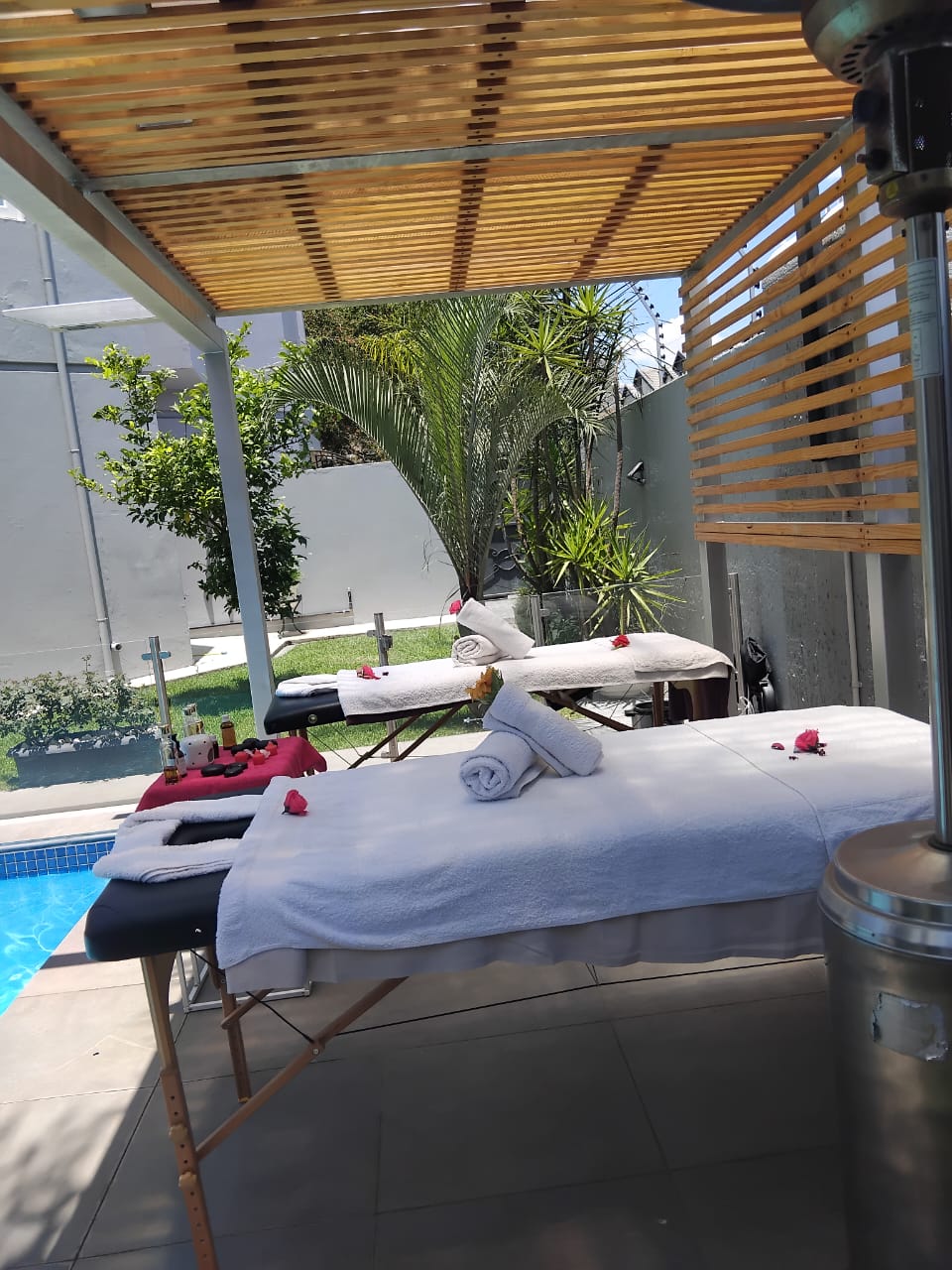 Outdoor mobile spa setup by pool